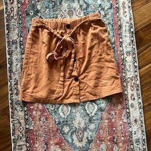 Orange skirt black buttons